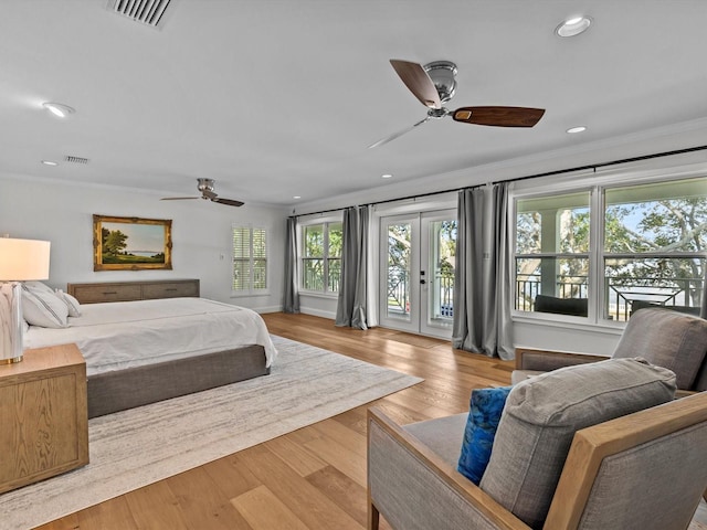 bedroom with access to outside, crown molding, light hardwood / wood-style floors, and ceiling fan