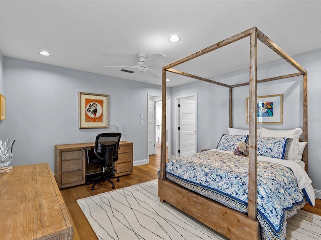 bedroom featuring hardwood / wood-style flooring and ceiling fan