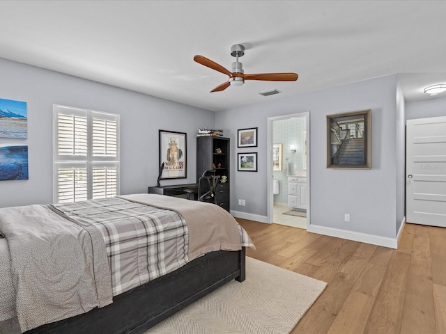 bedroom with ceiling fan, connected bathroom, and light hardwood / wood-style floors