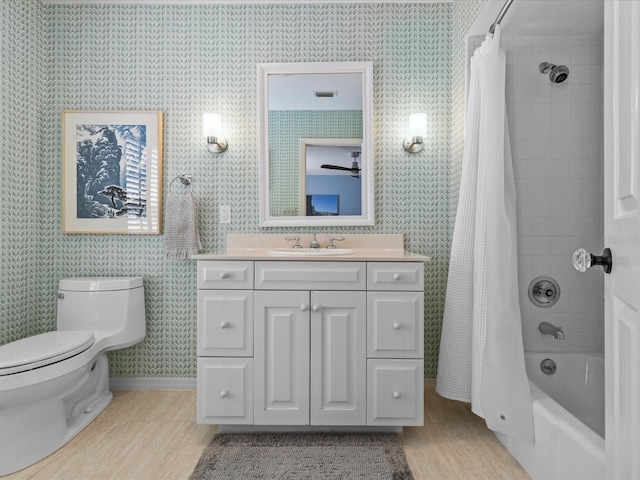 full bathroom with shower / bath combination with curtain, vanity, and toilet