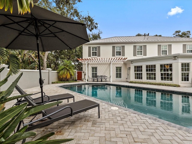 view of pool with a patio area and a pergola