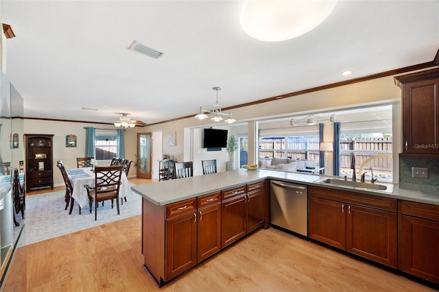 kitchen with decorative backsplash, kitchen peninsula, dishwasher, light wood-type flooring, and sink