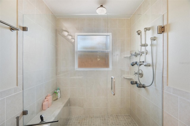 bathroom with walk in shower and tile walls