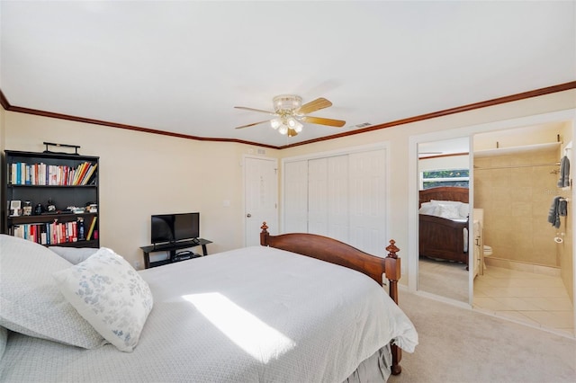 bedroom with connected bathroom, ornamental molding, light carpet, and ceiling fan