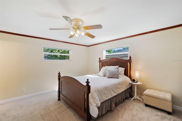 bedroom featuring ceiling fan, light carpet, and ornamental molding