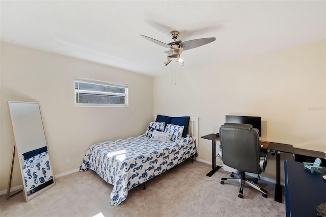 bedroom with ceiling fan and light colored carpet