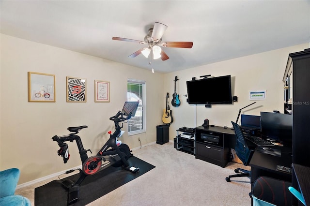 exercise room featuring ceiling fan and light colored carpet