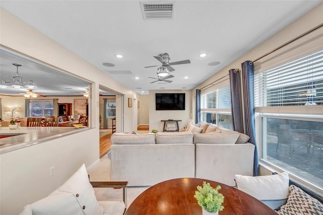 living area featuring recessed lighting, visible vents, and ceiling fan