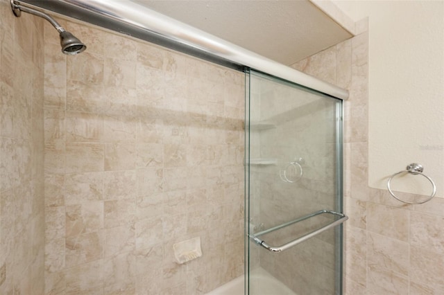 full bath with bath / shower combo with glass door