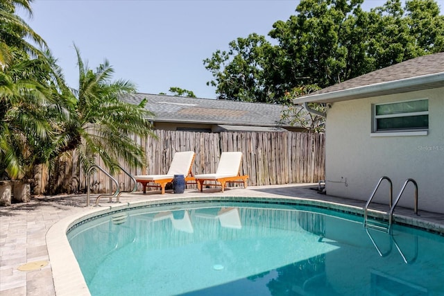 view of pool with fence and a fenced in pool