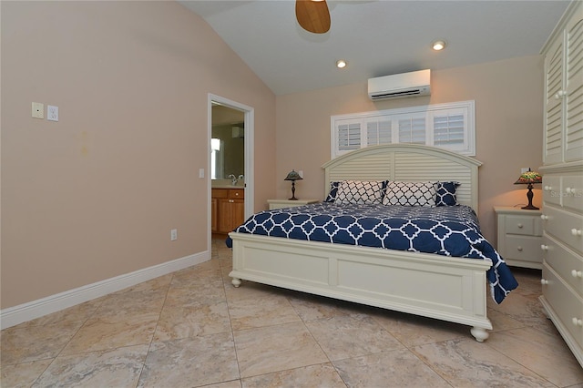 bedroom featuring ensuite bath, lofted ceiling, a wall mounted air conditioner, and ceiling fan