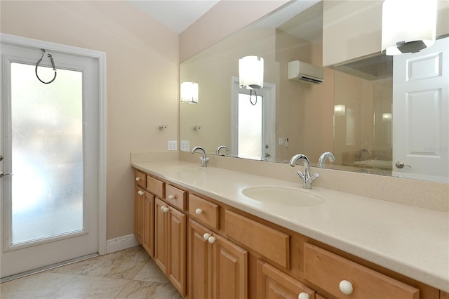 bathroom featuring vanity, a wall unit AC, and a healthy amount of sunlight