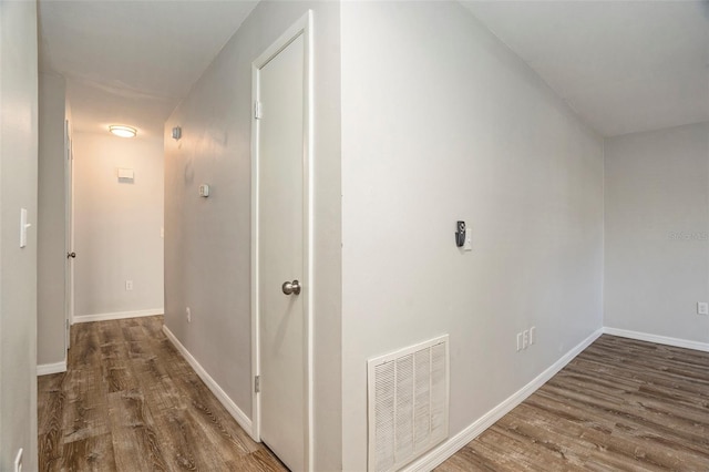 corridor featuring dark hardwood / wood-style floors