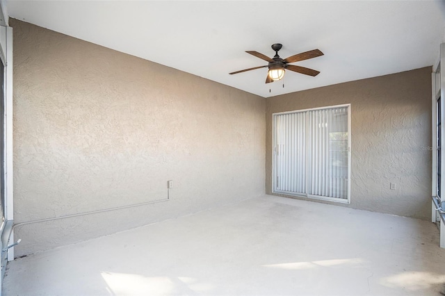 interior space with ceiling fan