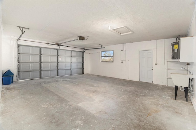 garage featuring a garage door opener and sink