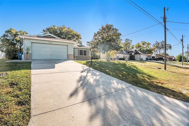 view of front of house with a garage and a front yard