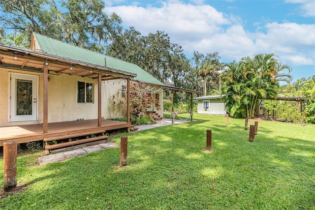 view of yard with a wooden deck