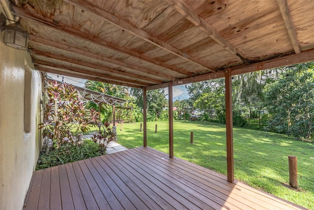 wooden deck featuring a yard