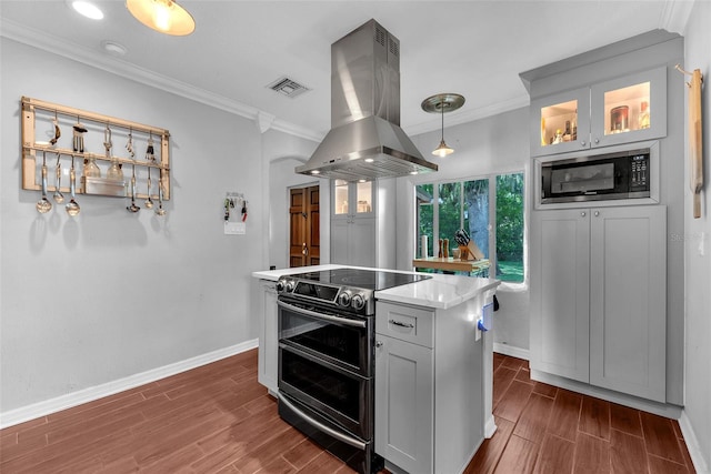 kitchen with island exhaust hood, electric stove, dark wood-type flooring, and built in microwave