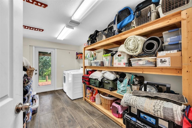 laundry area featuring separate washer and dryer and dark hardwood / wood-style flooring