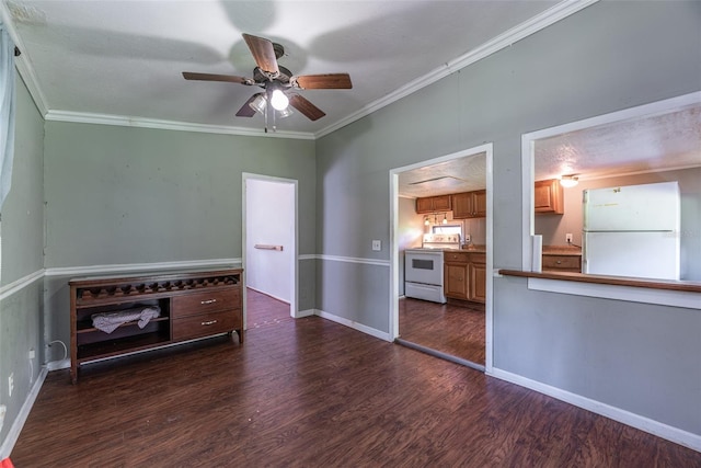 unfurnished room featuring ornamental molding, ceiling fan, and dark wood-type flooring