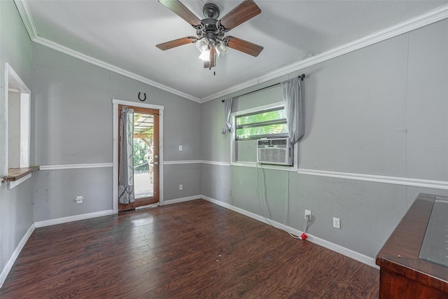 empty room featuring ornamental molding, cooling unit, vaulted ceiling, and dark hardwood / wood-style floors