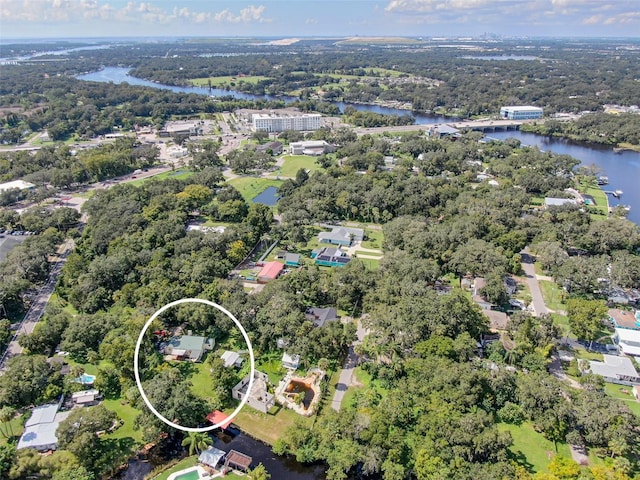 birds eye view of property with a water view