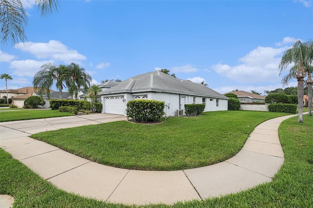 view of side of home with a lawn and a garage