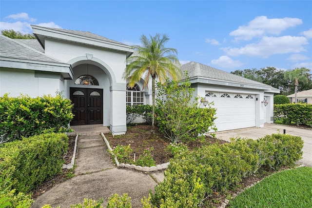 view of front of property with a garage