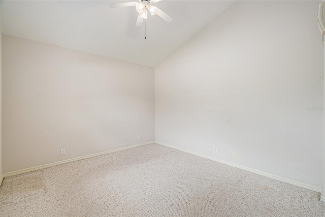 unfurnished room with lofted ceiling, ceiling fan, and carpet flooring