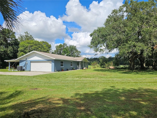 4810 N Galloway Rd, Lakeland, FL 33810 - view of front of house with a front lawn, cooling unit, an attached garage, and driveway