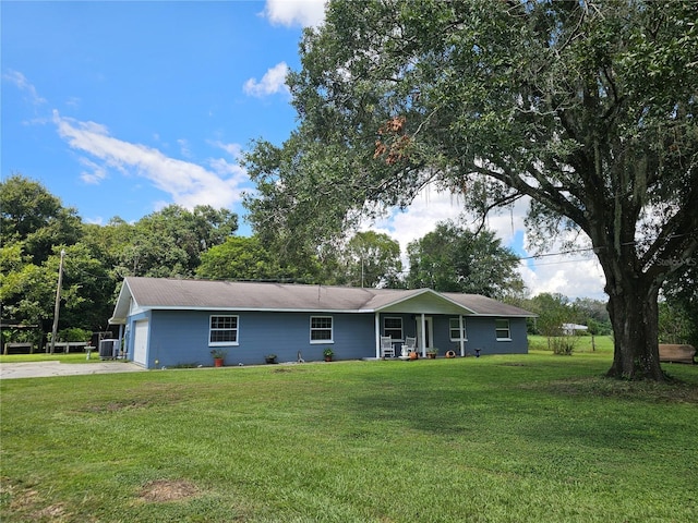 4810 N Galloway Rd, Lakeland, FL 33810 - ranch-style house featuring a front lawn, driveway, an attached garage, and central AC unit