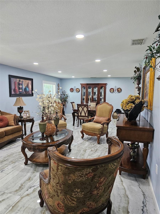 4810 N Galloway Rd, Lakeland, FL 33810 - living area with baseboards, a textured ceiling, and recessed lighting