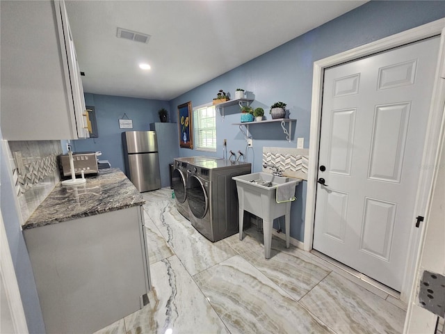 4810 N Galloway Rd, Lakeland, FL 33810 - laundry room featuring washing machine and clothes dryer and light marble finish floors