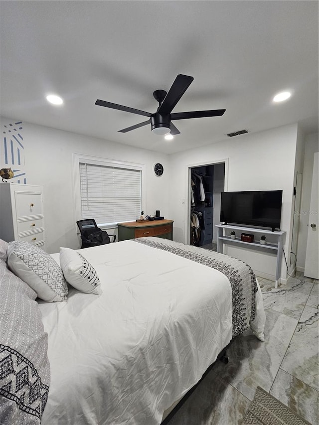 4810 N Galloway Rd, Lakeland, FL 33810 - bedroom with marble look tile flooring, recessed lighting, a ceiling fan, a closet, and a walk in closet
