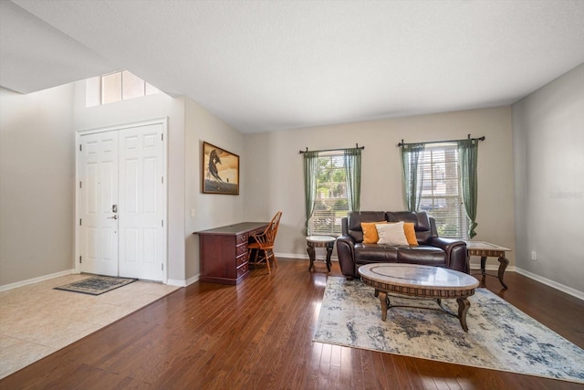 sitting room featuring a textured ceiling and dark hardwood / wood-style floors