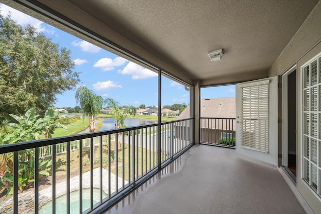 balcony featuring a water view