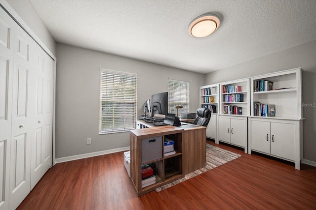 office featuring a textured ceiling and dark hardwood / wood-style floors