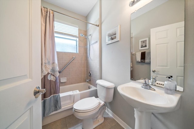 bathroom featuring shower / bath combo, tile patterned flooring, and toilet