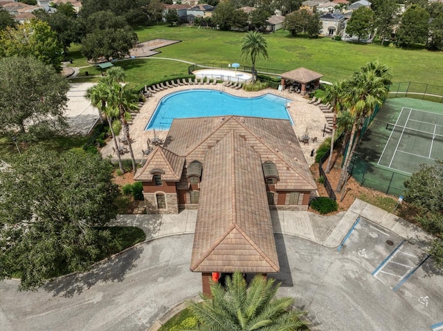 view of swimming pool featuring a patio and a yard