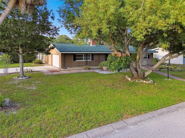 1756 Ashton Abbey Rd, Clearwater, FL 33755 - ranch-style house featuring driveway, a front yard, a garage, and a chimney