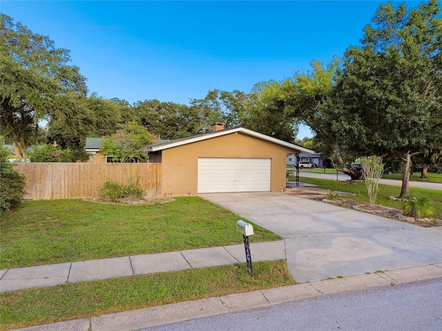 view of front facade featuring a front yard and a garage