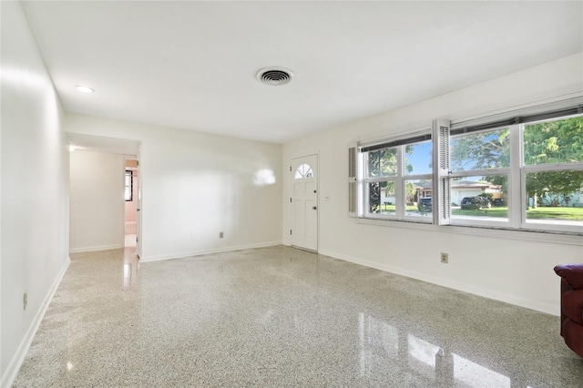 1756 Ashton Abbey Rd, Clearwater, FL 33755 - interior space featuring baseboards, visible vents, speckled floor, and recessed lighting