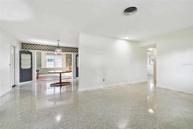 1756 Ashton Abbey Rd, Clearwater, FL 33755 - spare room with speckled floor, baseboards, and visible vents