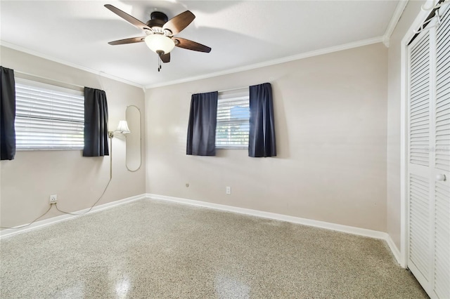 1756 Ashton Abbey Rd, Clearwater, FL 33755 - unfurnished bedroom with a closet, baseboards, ornamental molding, and speckled floor