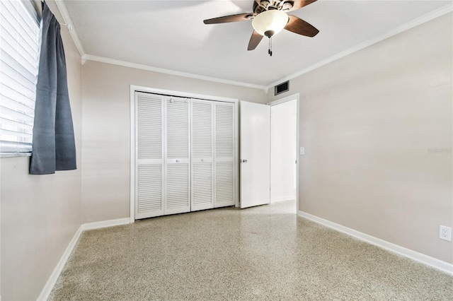 unfurnished bedroom featuring a closet, ceiling fan, and crown molding