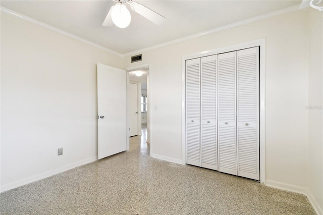 unfurnished bedroom featuring ornamental molding, a closet, and ceiling fan