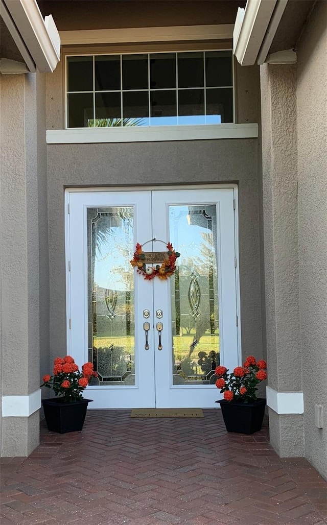 16015 Cape Coral Dr, Wimauma, FL 33598 - entrance to property with french doors and stucco siding