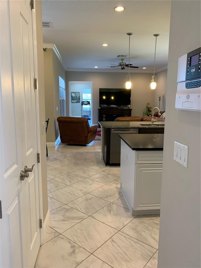 kitchen with sink, crown molding, stainless steel dishwasher, pendant lighting, and ceiling fan