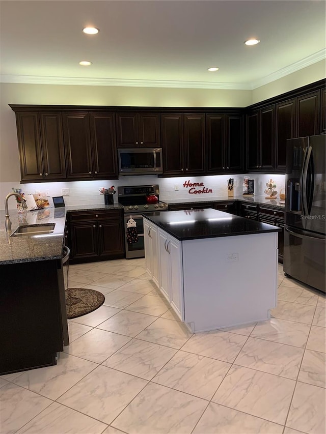 16015 Cape Coral Dr, Wimauma, FL 33598 - kitchen with appliances with stainless steel finishes, a sink, light marble finish flooring, ornamental molding, and recessed lighting